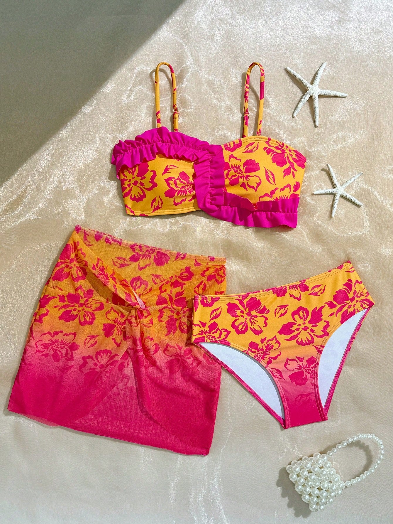 Tween girls bikini set with shell and starfish woven band details, spaghetti strap sleeveless top, and mid-waist skirt-style bottom in blue.