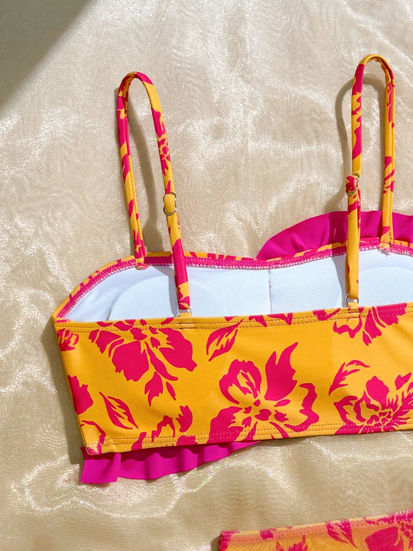 Tween girls bikini set with shell and starfish woven band details, spaghetti strap sleeveless top, and mid-waist skirt-style bottom in blue.