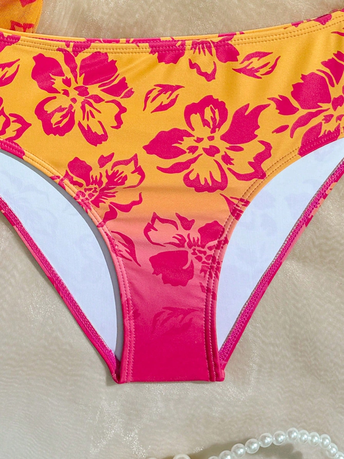 Tween girls bikini set with shell and starfish woven band details, spaghetti strap sleeveless top, and mid-waist skirt-style bottom in blue.