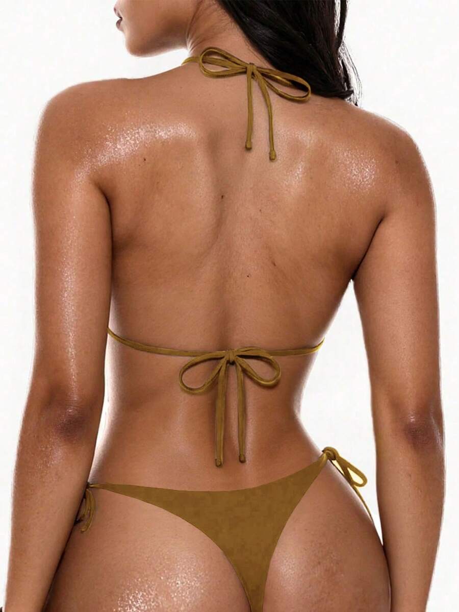 Women's halter neck bikini swimwear set featuring a wireless backless top and low-waist tie-side thong bottoms.