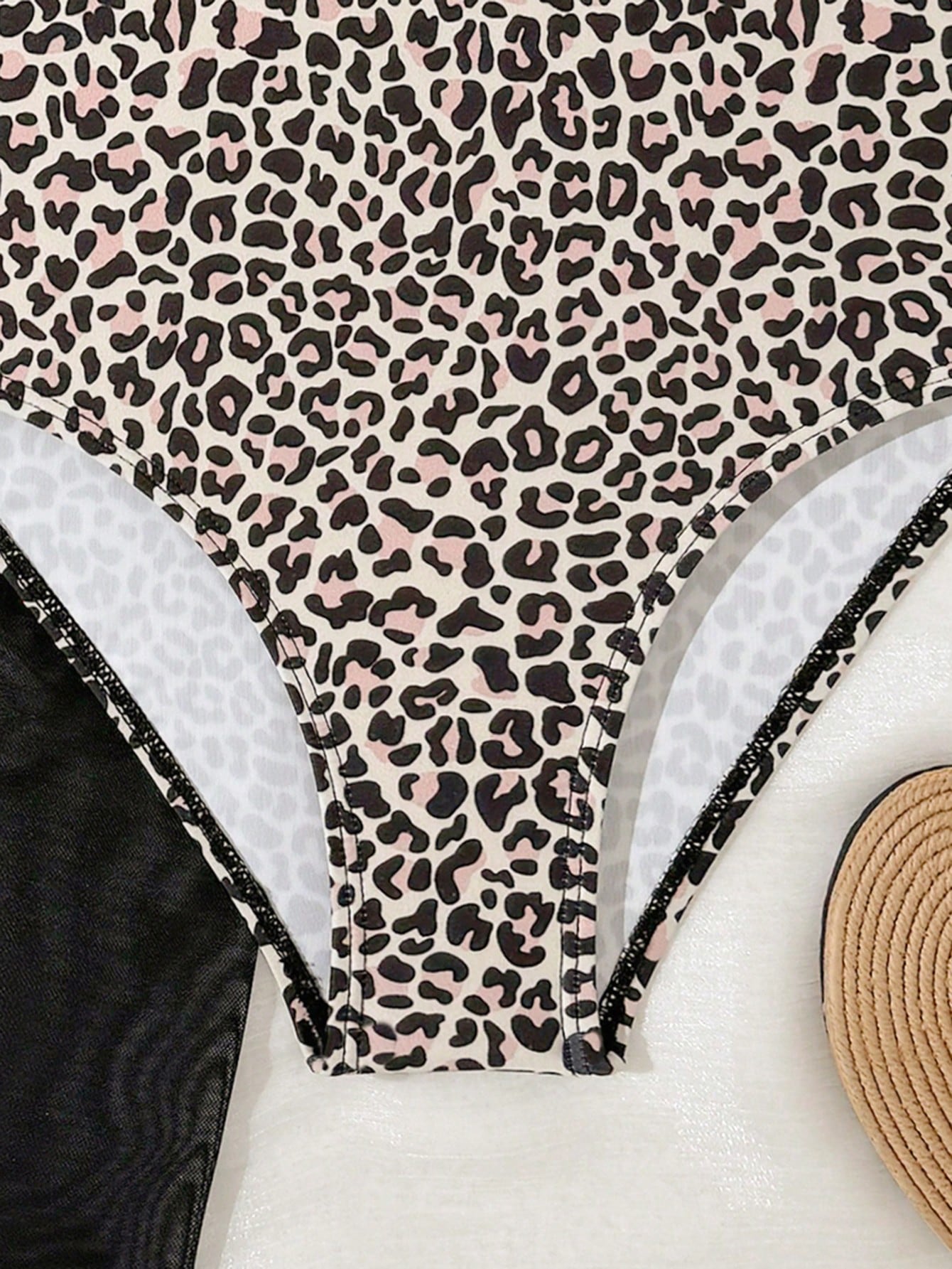 Tween girls one-piece swimsuit in leopard print with ruffle shoulder straps, scoop neckline, fitted shape, and attached ruffle hem skirt; sleeveless, mid-waist skirt bottom, and lined body for swimming, vacation, and summer beach wear.