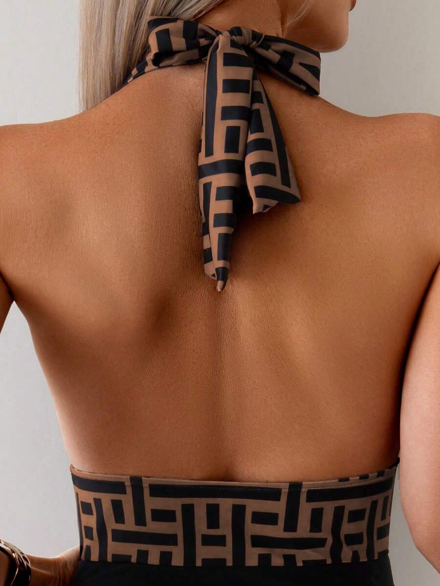 Apricot women's one-piece swimsuit featuring a halter neckline, backless tie-back detail, and ruched knitted fabric.