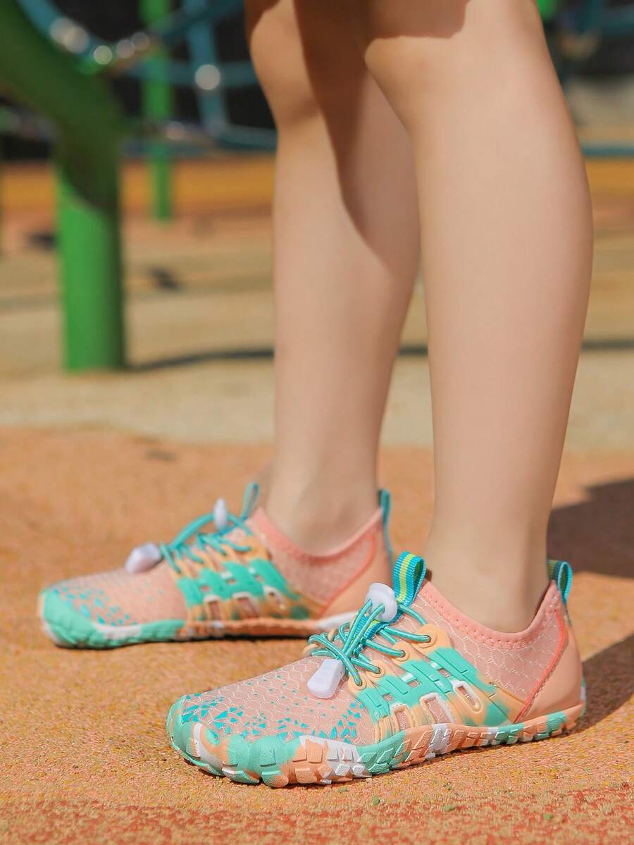 Apricot children's water shoes featuring slip-on fabric uppers, drawstring details, and rubber soles for beach play.