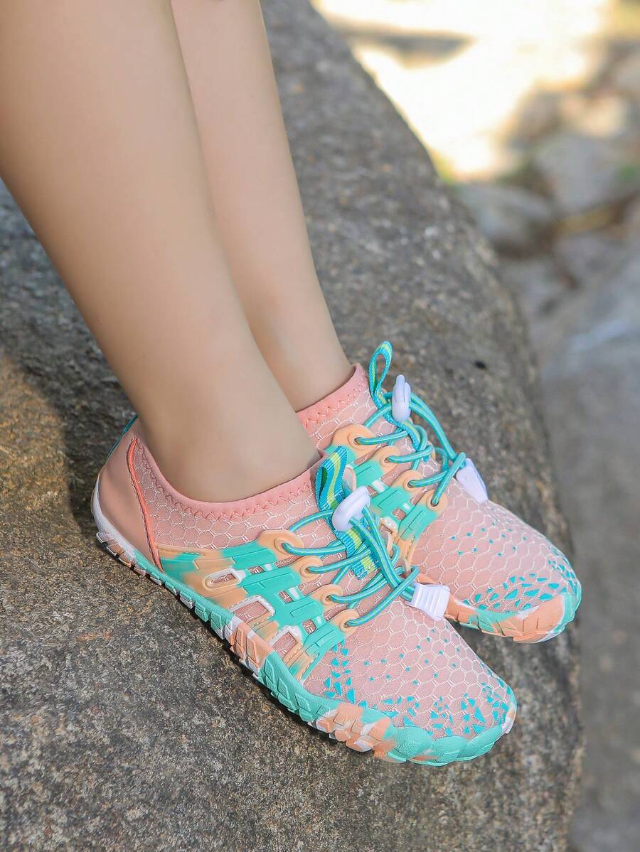 Apricot children's water shoes featuring slip-on fabric uppers, drawstring details, and rubber soles for beach play.