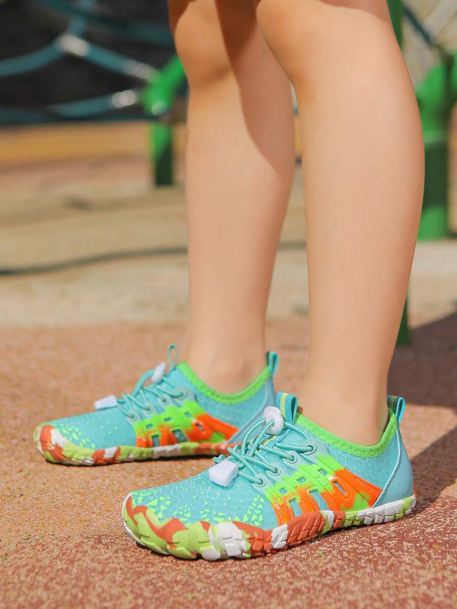 Apricot children's water shoes featuring slip-on fabric uppers, drawstring details, and rubber soles for beach play.