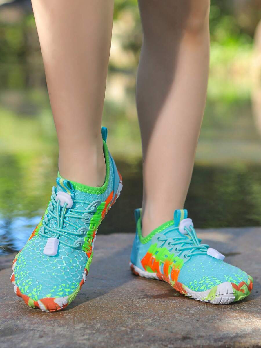 Apricot children's water shoes featuring slip-on fabric uppers, drawstring details, and rubber soles for beach play.