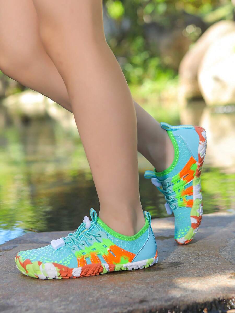 Apricot children's water shoes featuring slip-on fabric uppers, drawstring details, and rubber soles for beach play.