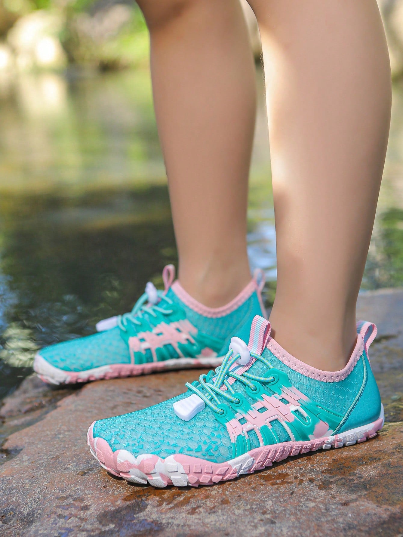 Apricot children's water shoes featuring slip-on fabric uppers, drawstring details, and rubber soles for beach play.