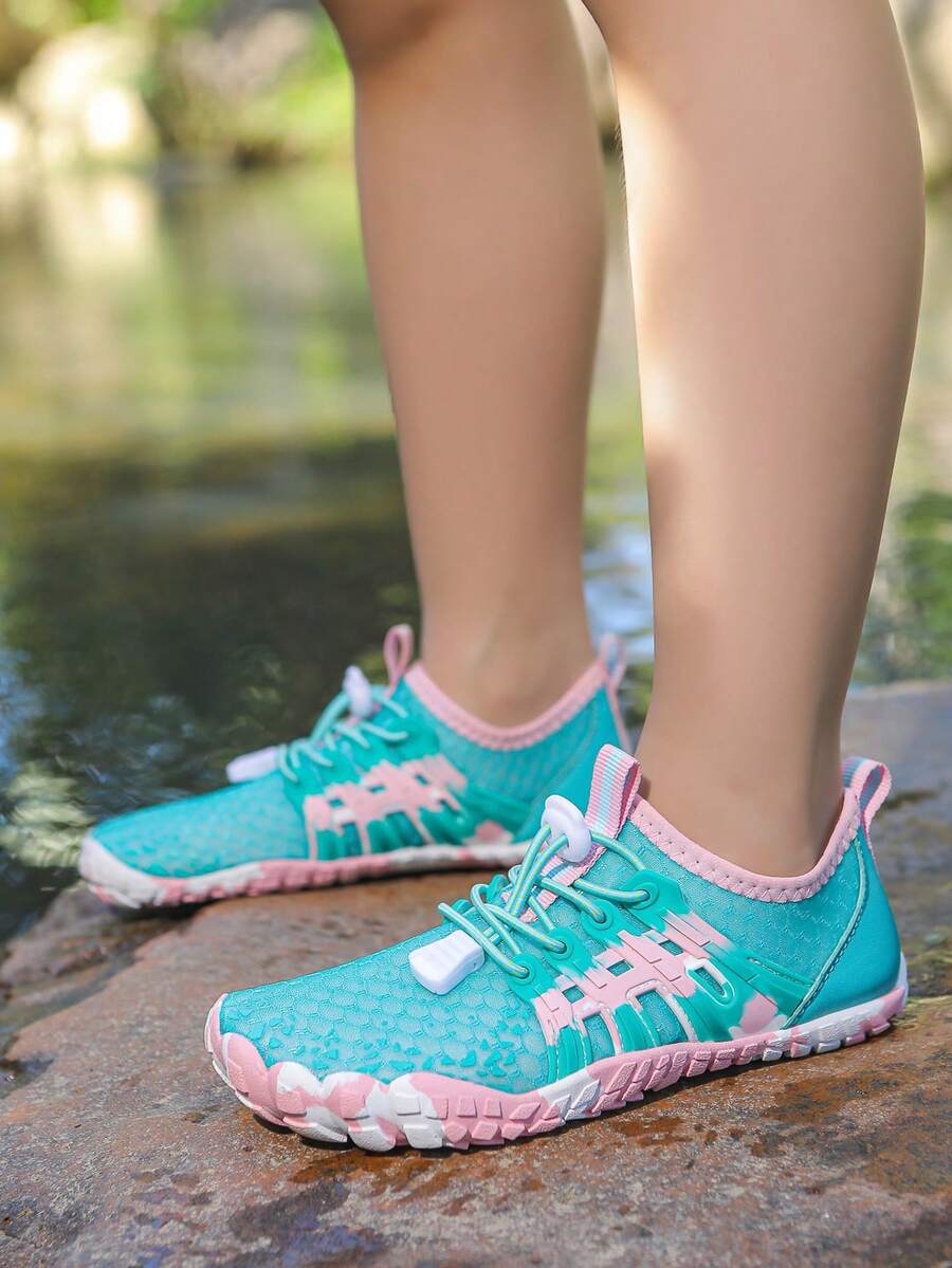 Apricot children's water shoes featuring slip-on fabric uppers, drawstring details, and rubber soles for beach play.