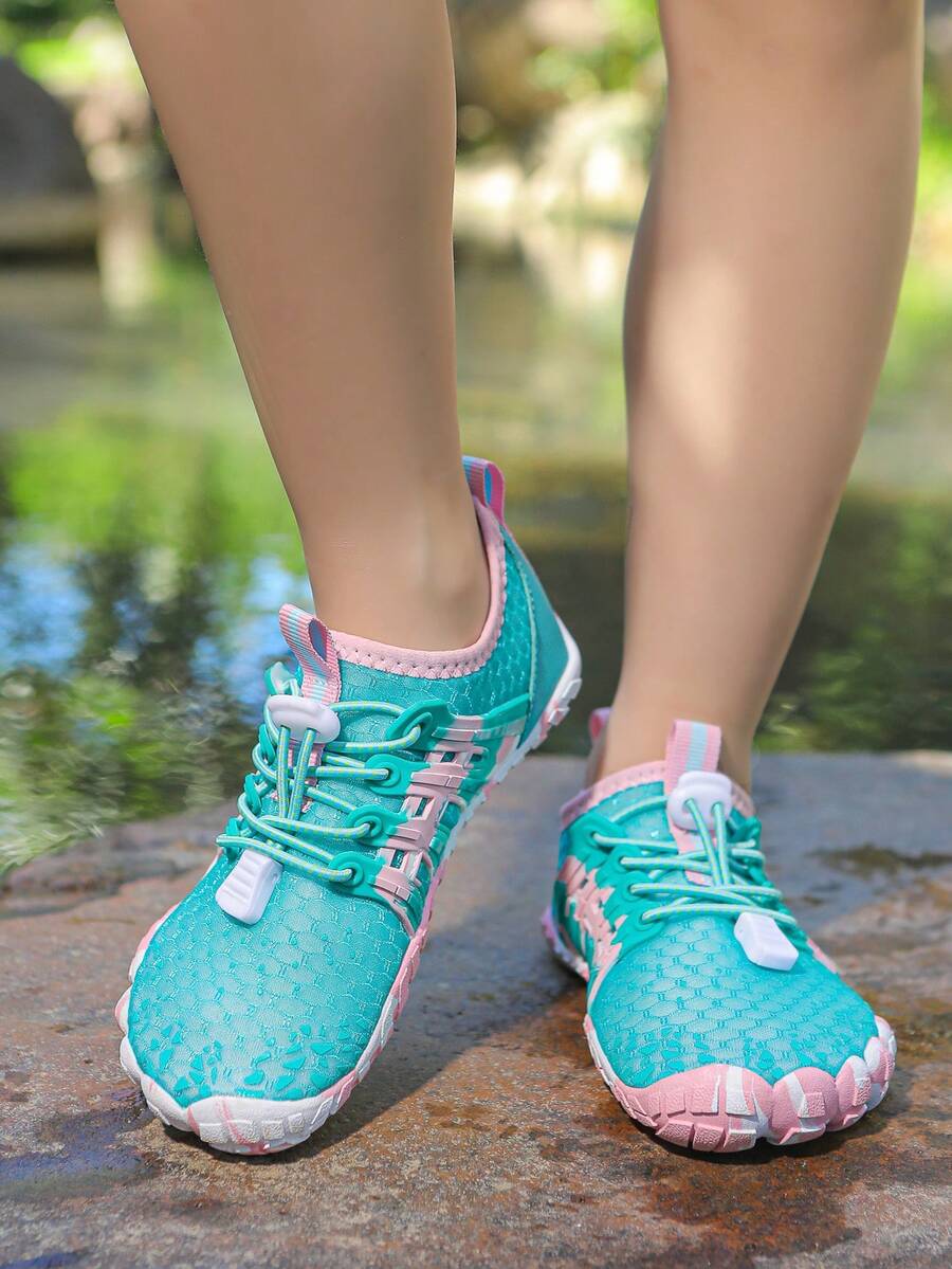 Apricot children's water shoes featuring slip-on fabric uppers, drawstring details, and rubber soles for beach play.
