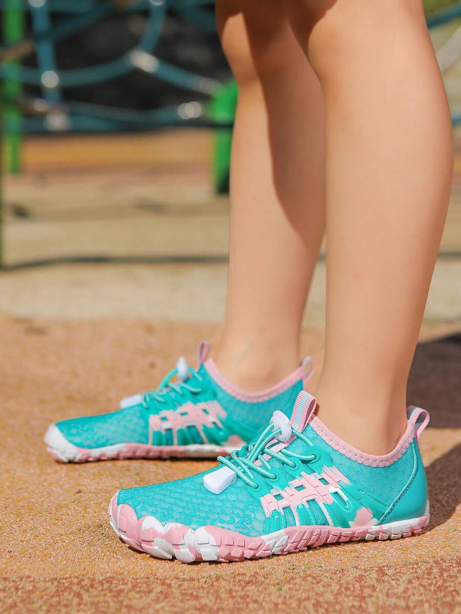 Apricot children's water shoes featuring slip-on fabric uppers, drawstring details, and rubber soles for beach play.