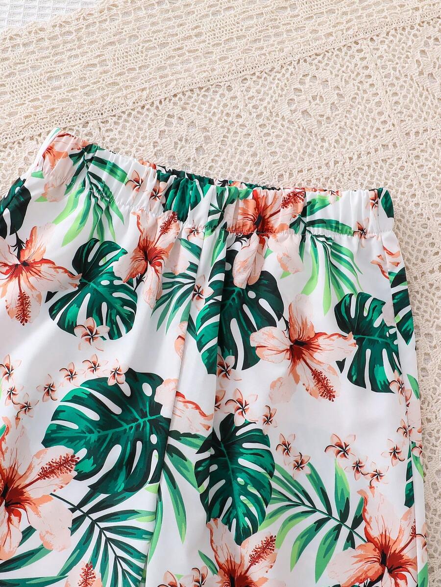 Tween girls blue 2-piece vacation outfit set featuring a tiered ruffle spaghetti strap camisole and loose high-waist pants.