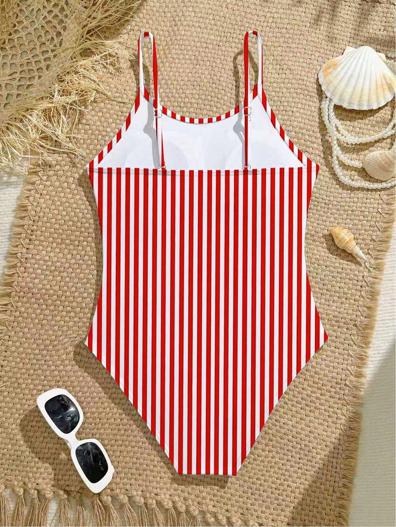 Purple tween girls one-piece swimsuit with asymmetrical neckline, cut-out waist, striped pattern, fitted silhouette, and lined body.