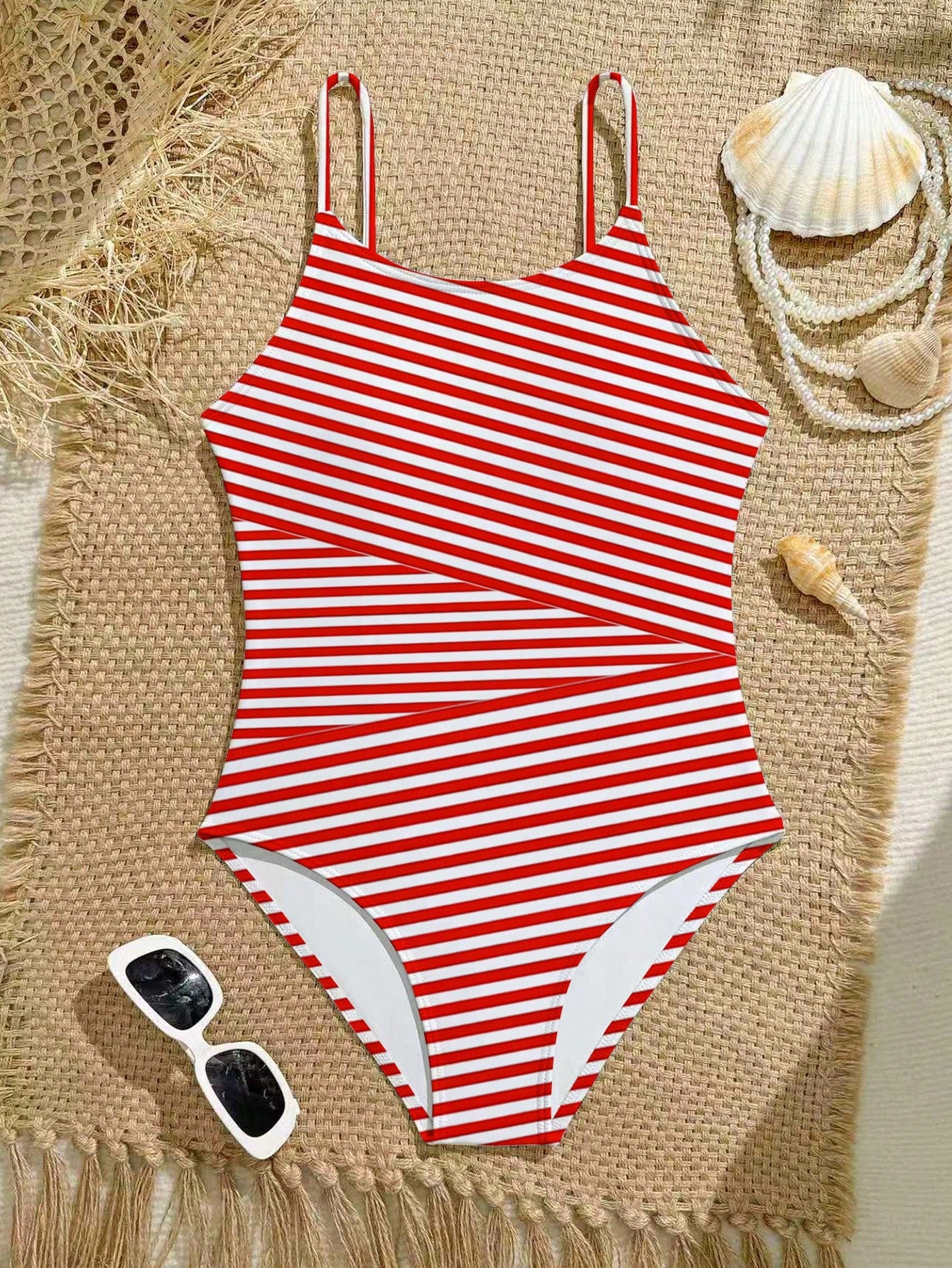 Purple tween girls one-piece swimsuit with asymmetrical neckline, cut-out waist, striped pattern, fitted silhouette, and lined body.