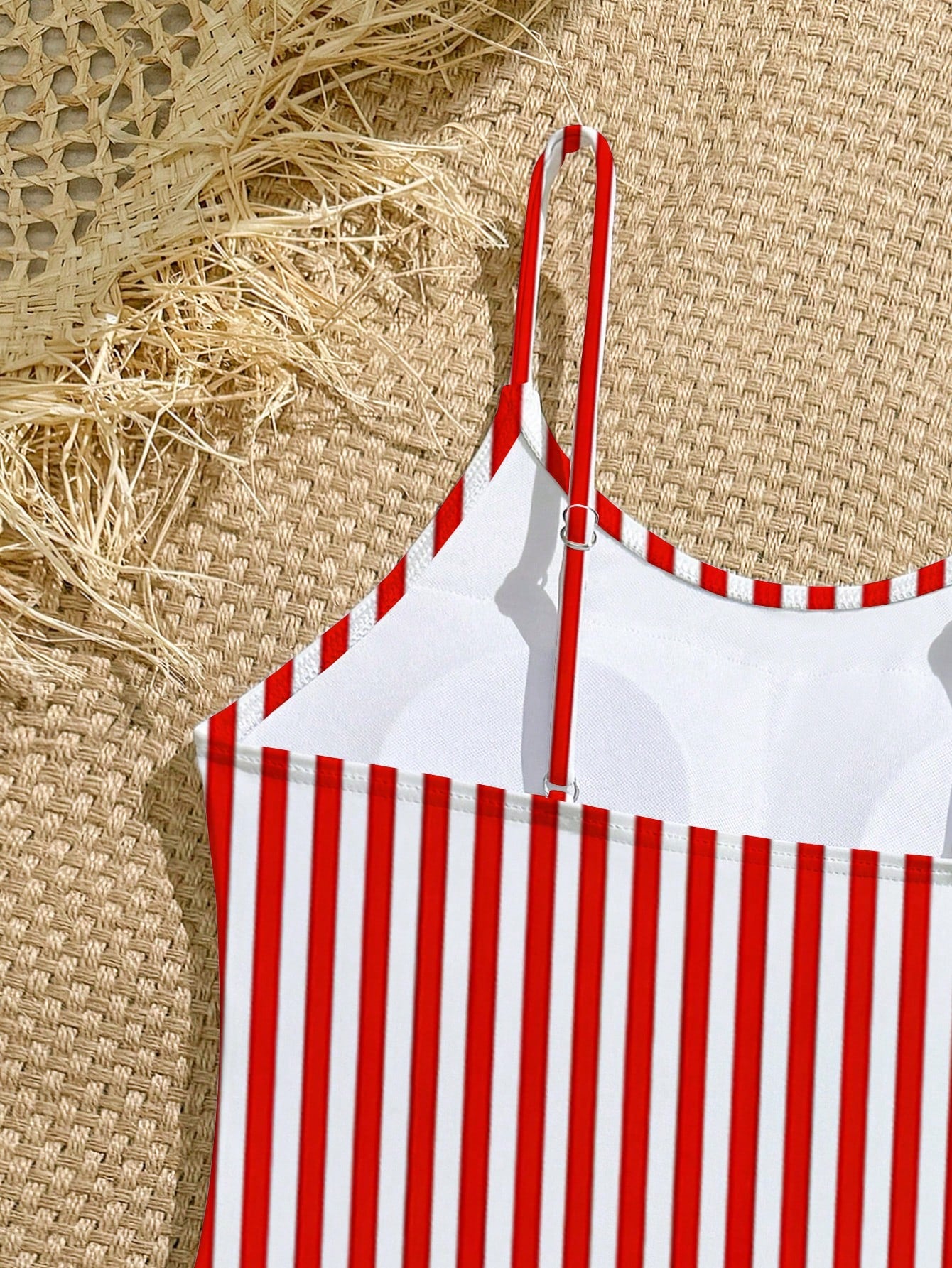 Purple tween girls one-piece swimsuit with asymmetrical neckline, cut-out waist, striped pattern, fitted silhouette, and lined body.