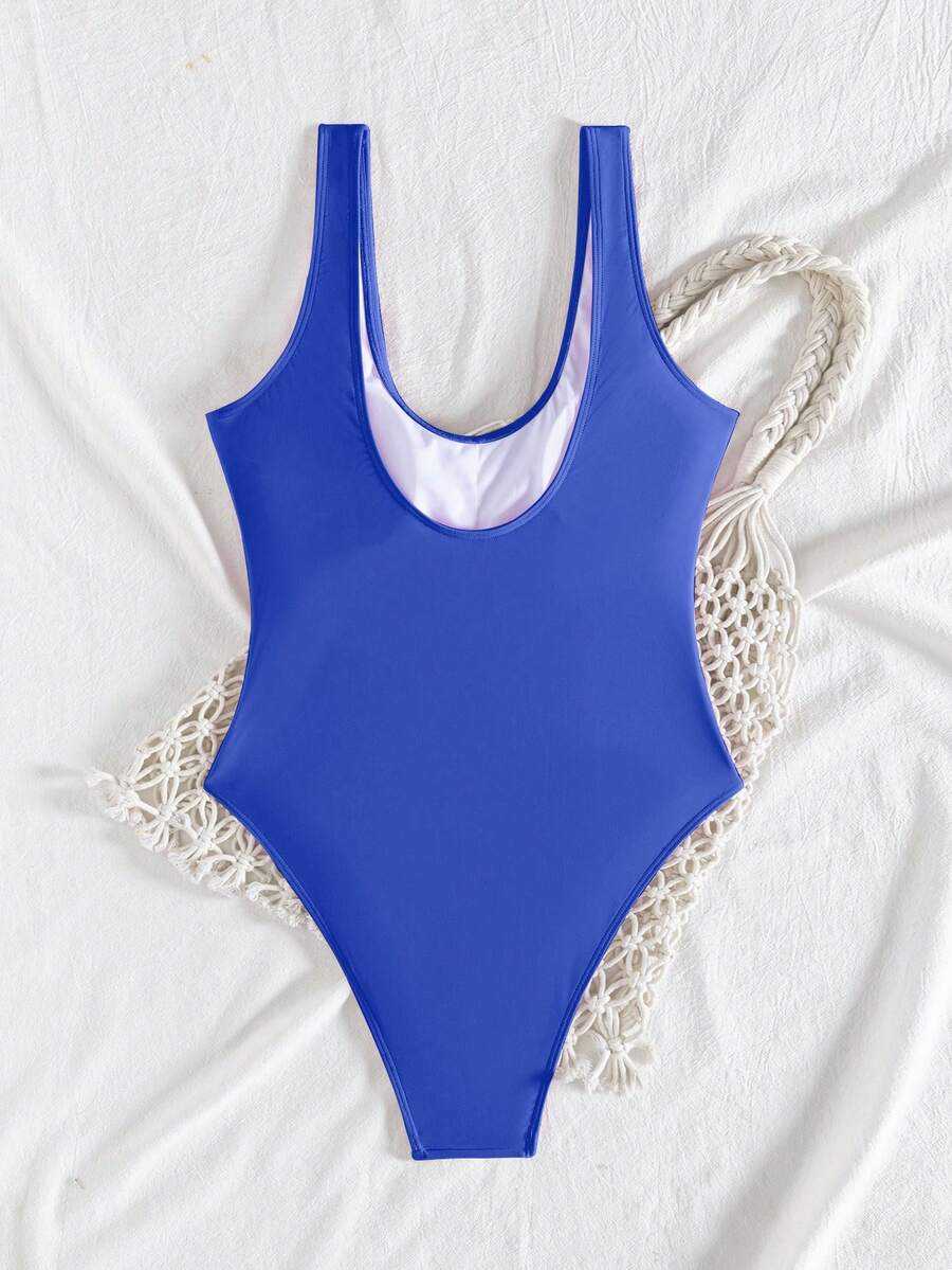 Women's solid color one-piece swimsuit featuring a backless scoop neck design and high cut fit