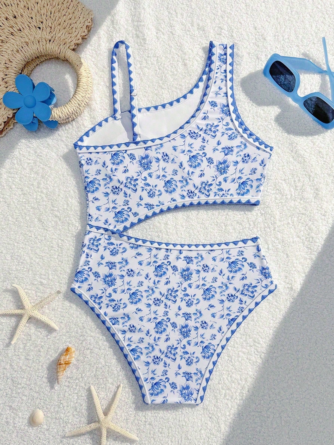 Tween girls one-piece swimsuit featuring an asymmetric neckline, pendant decor, plain design, wireless bra, high-cut bottom, and medium-stretch fabric.