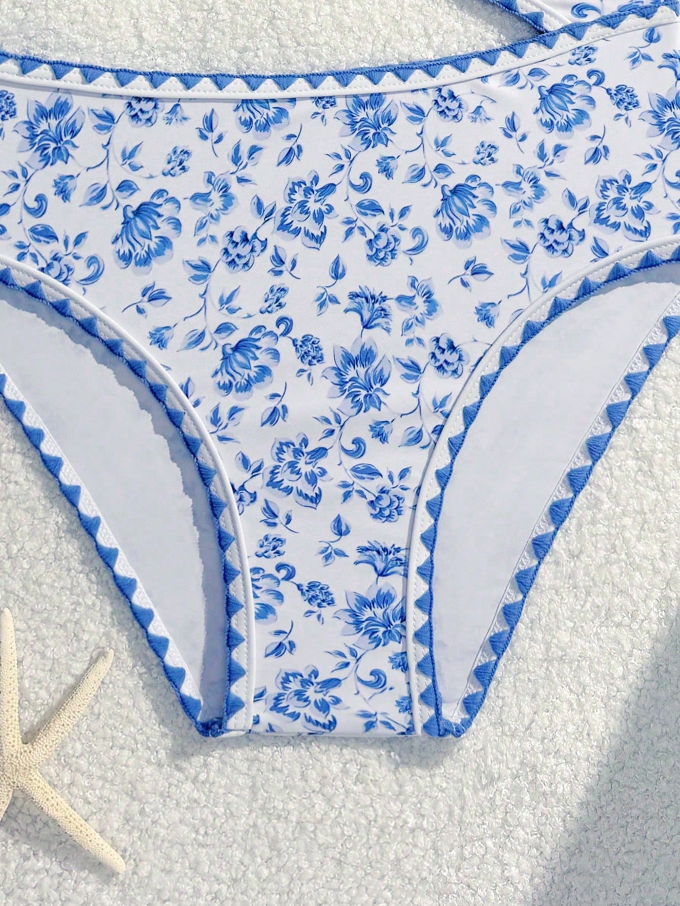 Tween girls one-piece swimsuit featuring an asymmetric neckline, pendant decor, plain design, wireless bra, high-cut bottom, and medium-stretch fabric.