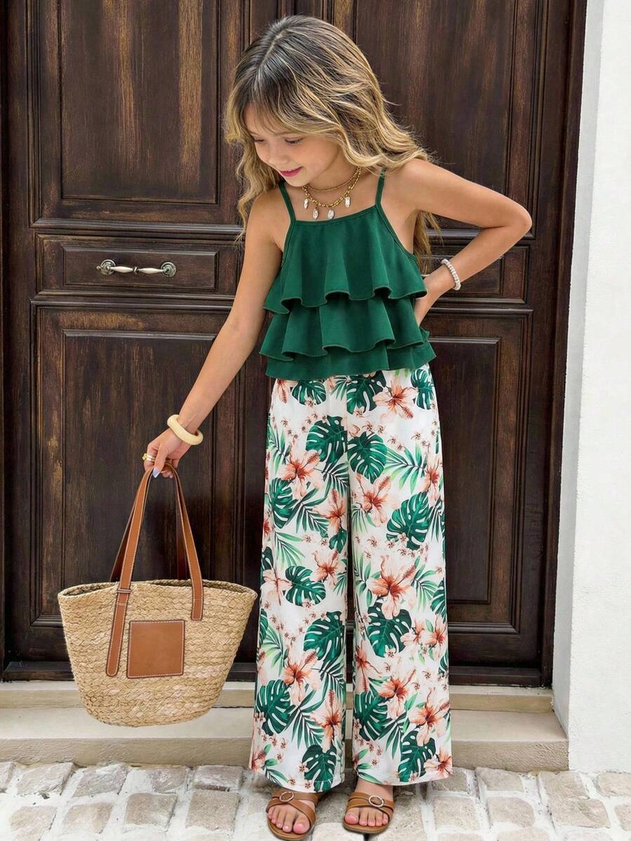 Tween girls blue 2-piece vacation outfit set featuring a tiered ruffle spaghetti strap camisole and loose high-waist pants.