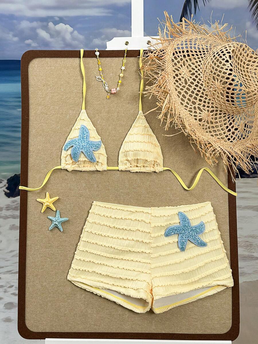 Women's apricot two-piece swimsuit set with a halter tie-back top and matching high stretch shorts.