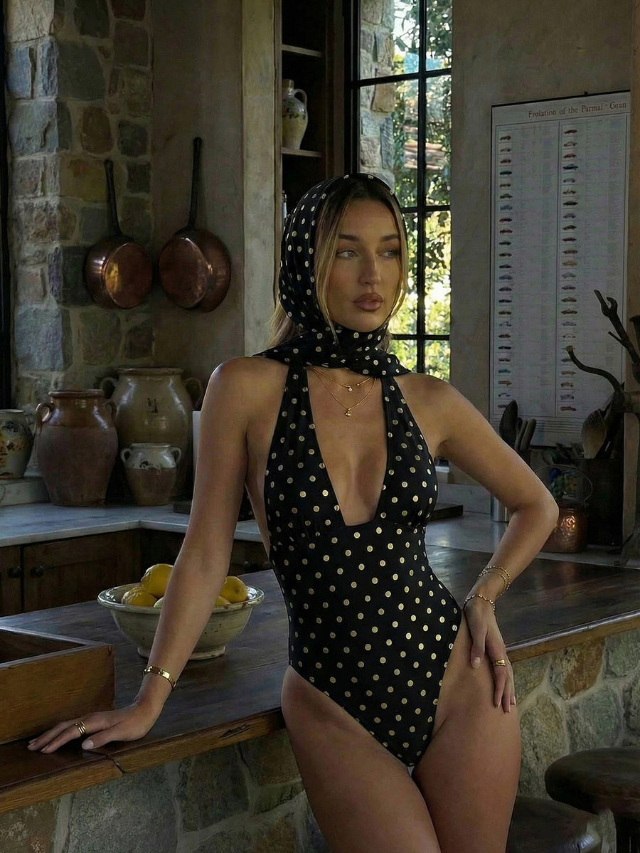 Women's apricot polka dot two-piece swimsuit featuring an asymmetrical halter backless top with knot tie detail and high-waisted bottoms.