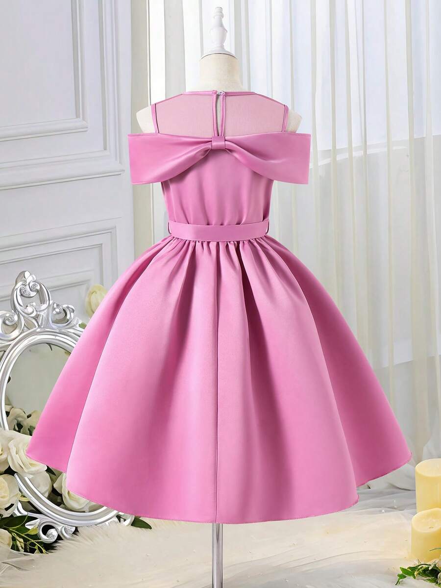 Tween girls dusty blue casual A-line dress with round neck, ruffle accents, high waist, and flared hem.