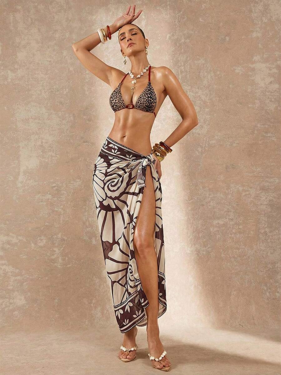 Women's black and white halter triangle bikini top and high waist tie side thong bottoms set.