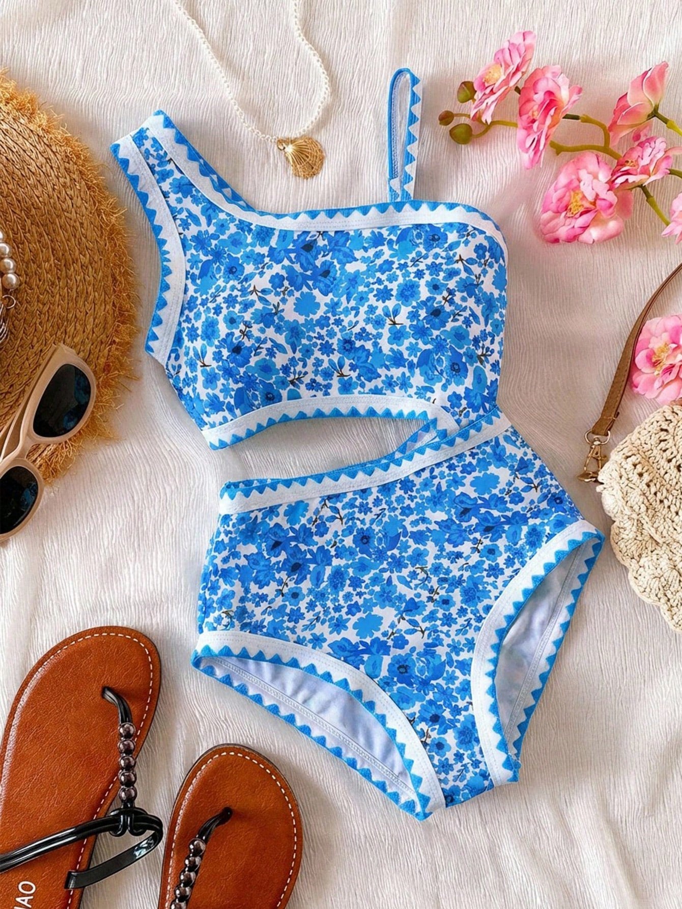 Tween girls one-piece swimsuit featuring an asymmetric neckline, pendant decor, plain design, wireless bra, high-cut bottom, and medium-stretch fabric.