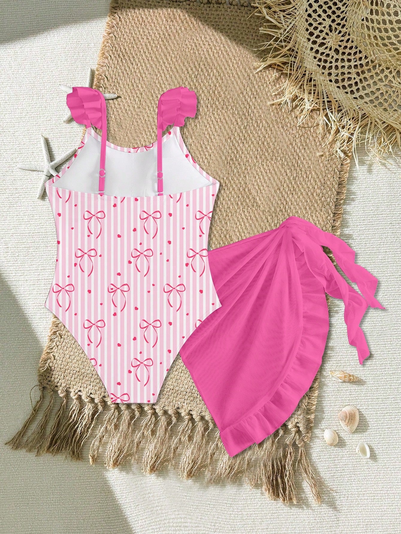 Tween girls one-piece swimsuit in leopard print with ruffle shoulder straps, scoop neckline, fitted shape, and attached ruffle hem skirt; sleeveless, mid-waist skirt bottom, and lined body for swimming, vacation, and summer beach wear.