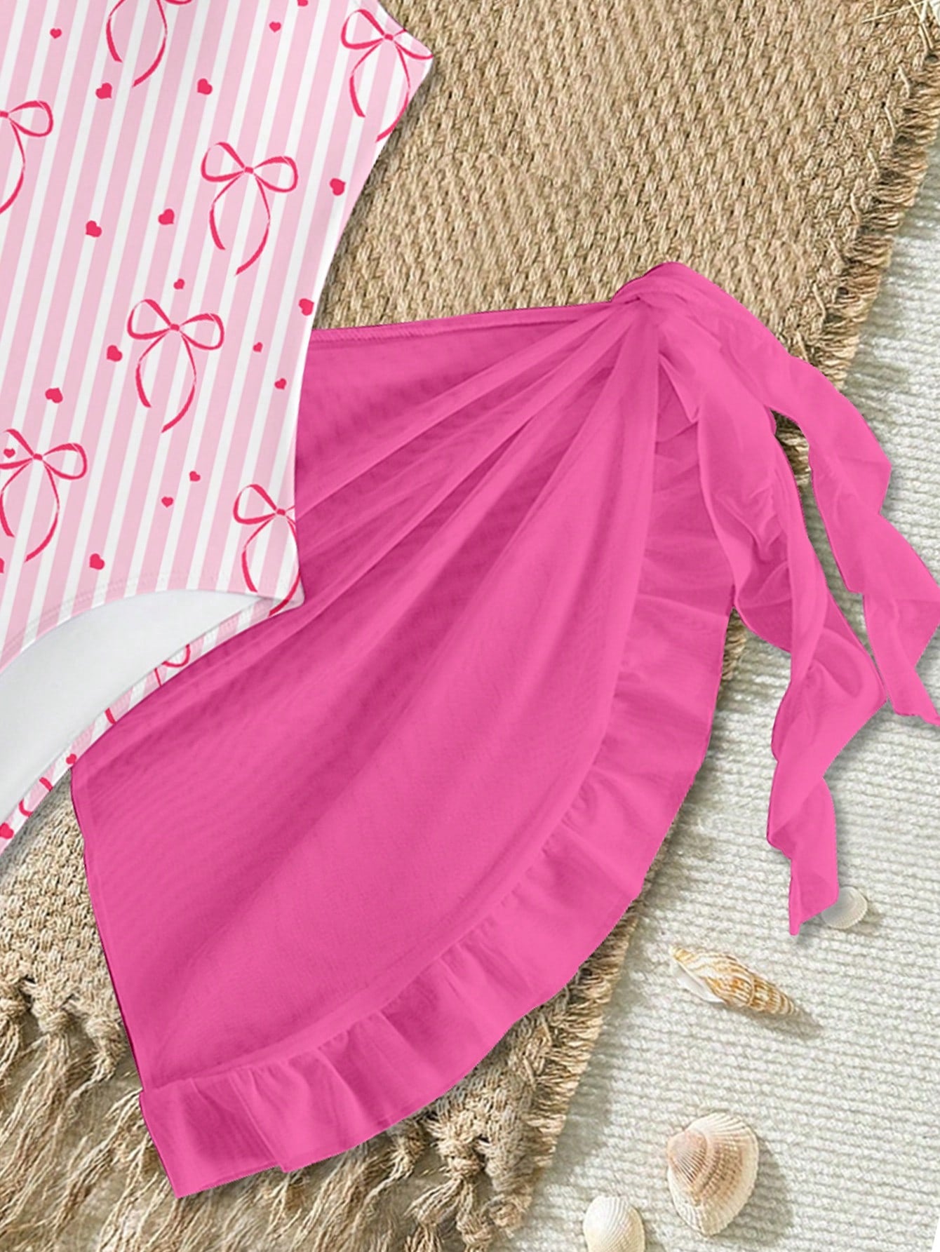 Tween girls one-piece swimsuit in leopard print with ruffle shoulder straps, scoop neckline, fitted shape, and attached ruffle hem skirt; sleeveless, mid-waist skirt bottom, and lined body for swimming, vacation, and summer beach wear.