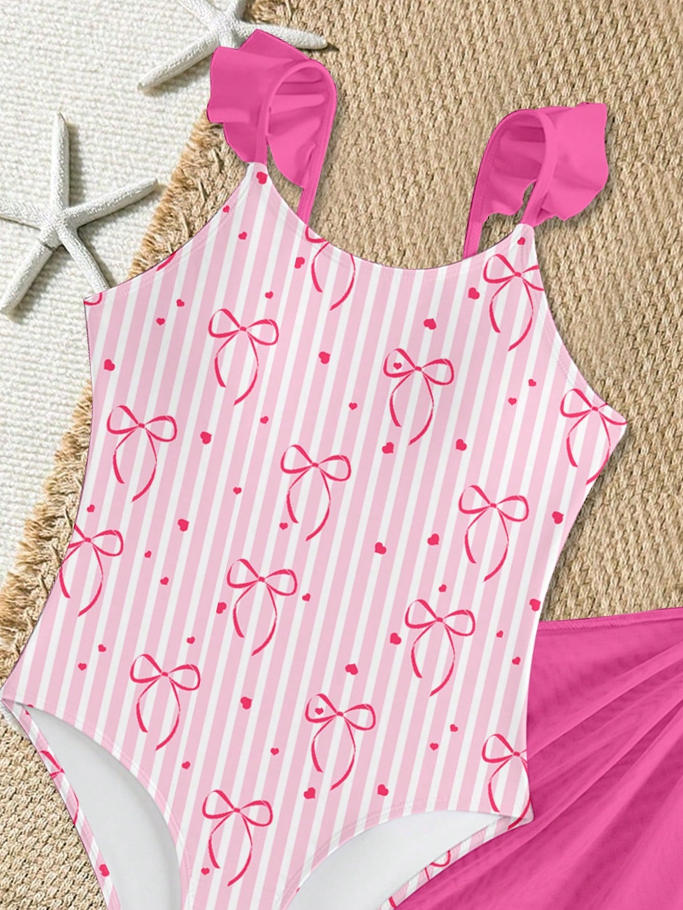 Tween girls one-piece swimsuit in leopard print with ruffle shoulder straps, scoop neckline, fitted shape, and attached ruffle hem skirt; sleeveless, mid-waist skirt bottom, and lined body for swimming, vacation, and summer beach wear.