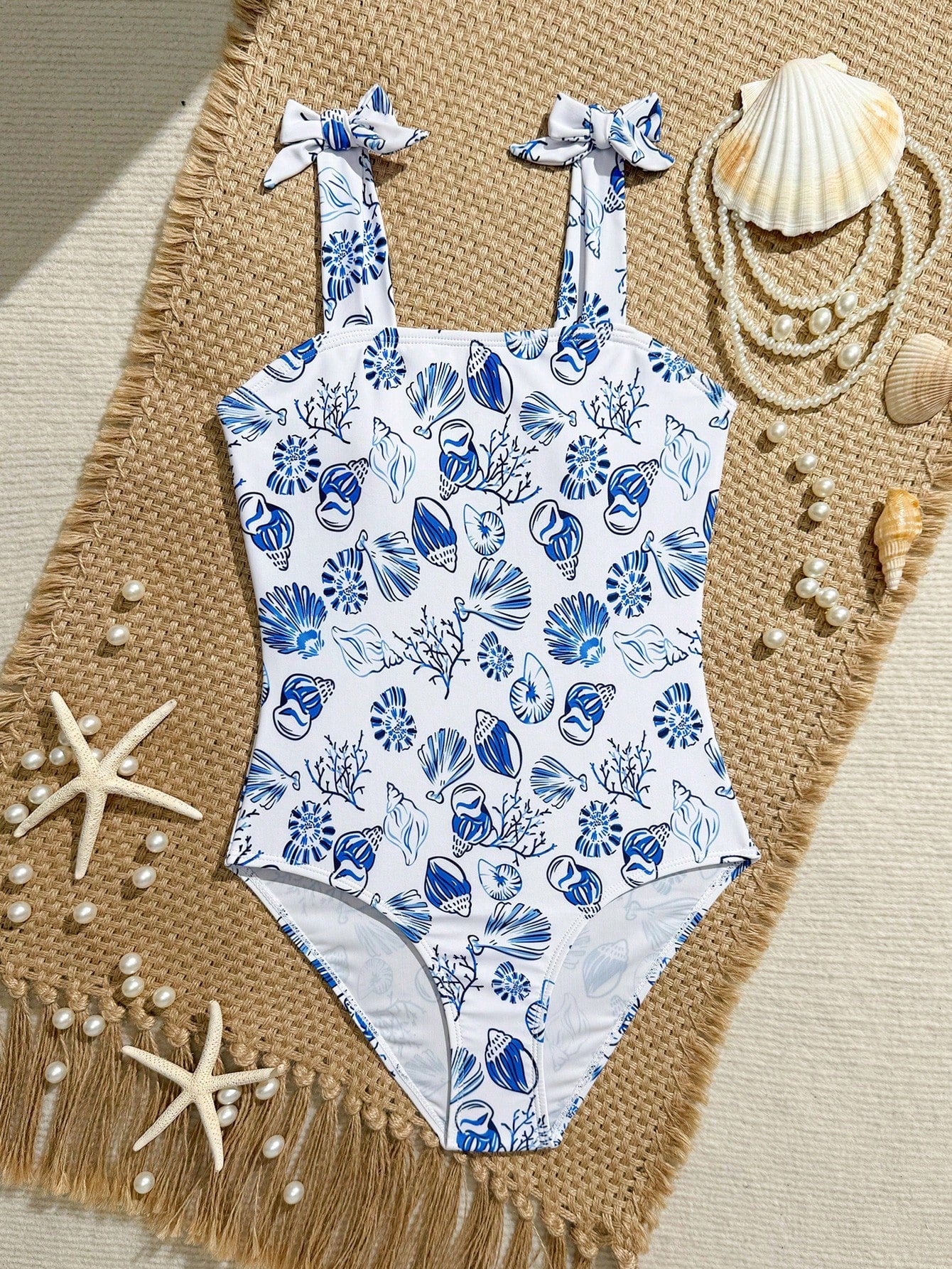 Tween girl one-piece swimsuit with floral plant print, asymmetrical neckline, cut-out detail, and fitted high-stretch design for beach and pool wear