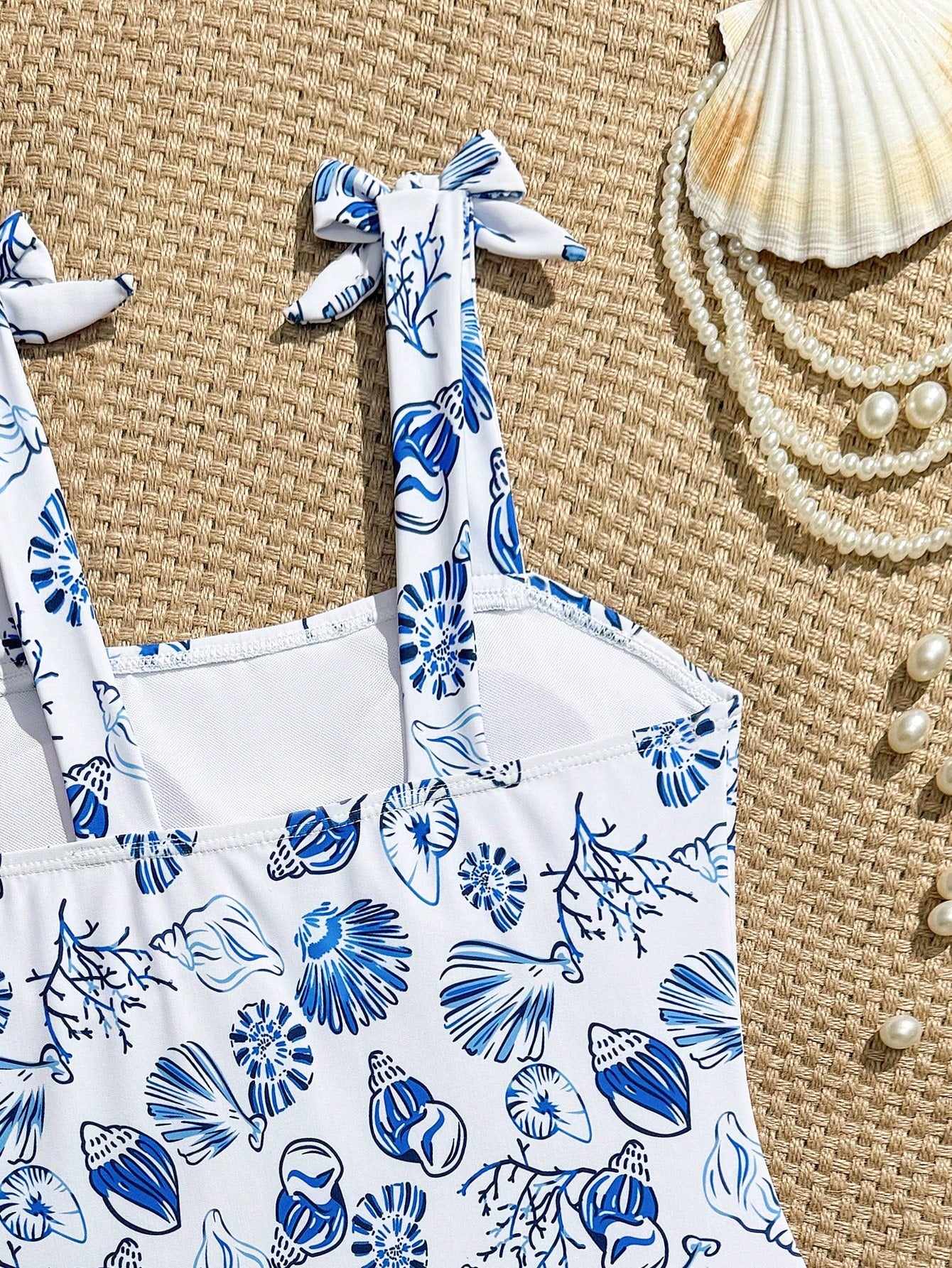 Tween girl one-piece swimsuit with floral plant print, asymmetrical neckline, cut-out detail, and fitted high-stretch design for beach and pool wear