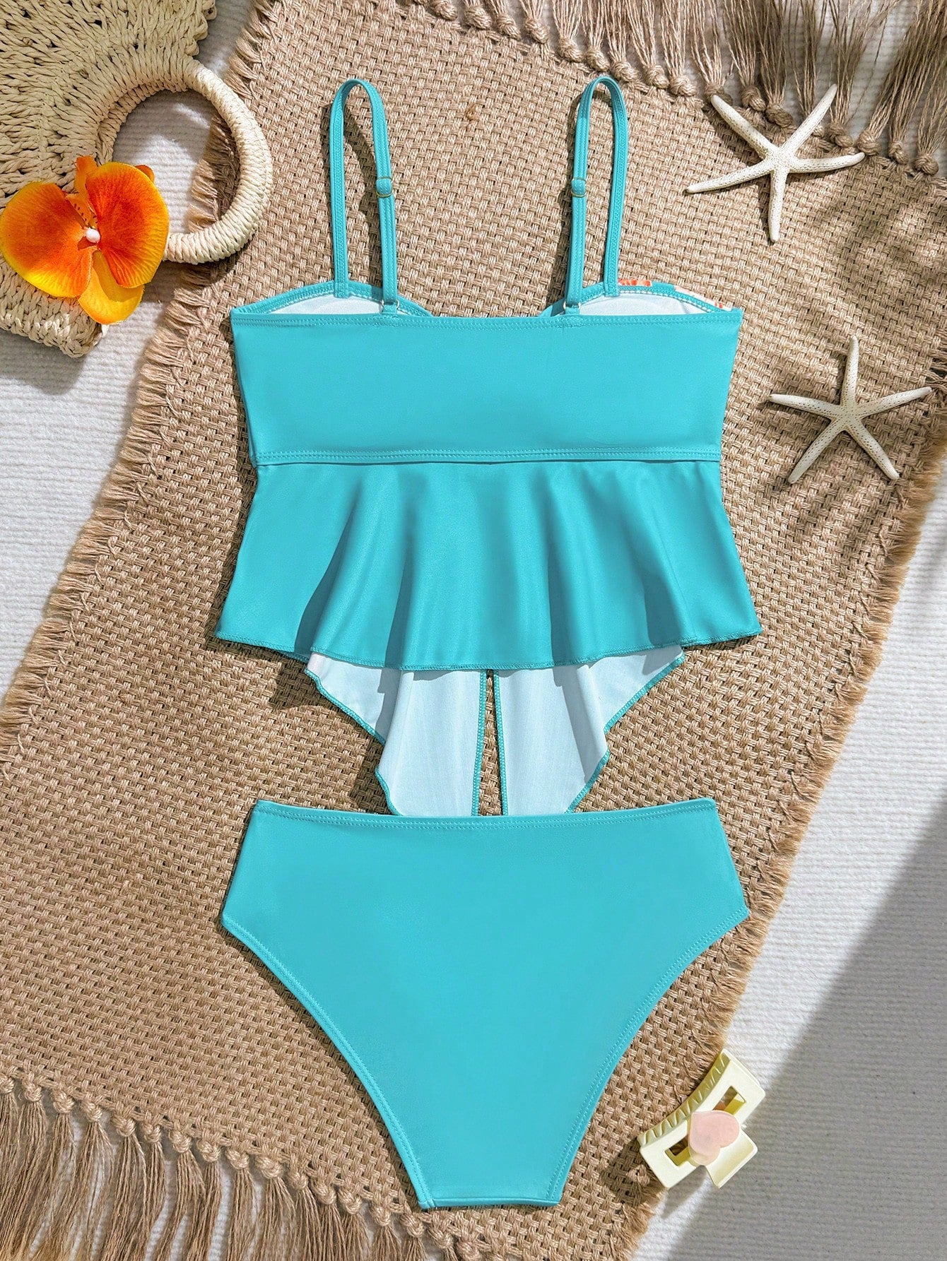 Tween girls 2-piece tankini swimwear set in apricot with a textured jacquard look, asymmetrical spaghetti-strap sleeveless top, and matching mid-waist short bikini bottoms.