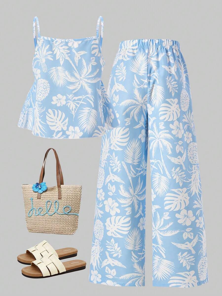 Tween girls light blue 2-piece summer vacation outfit featuring a plant print spaghetti strap camisole top with shirred ruffle hem and wide-leg long pants.