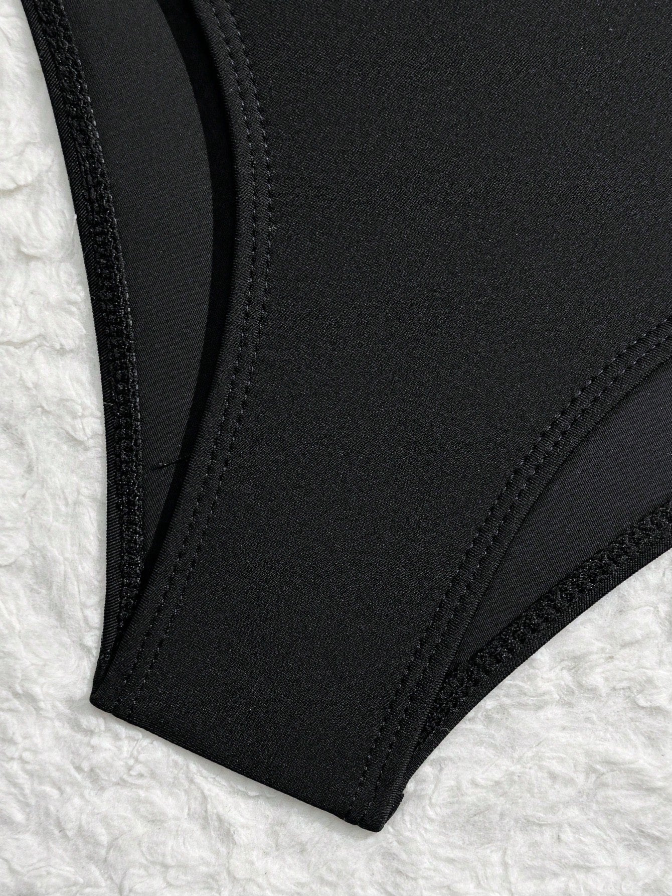 Black girls' one-piece swimsuit with spaghetti straps, plain design, and short asymmetrical mesh ruffle skirt for beach or vacation wear