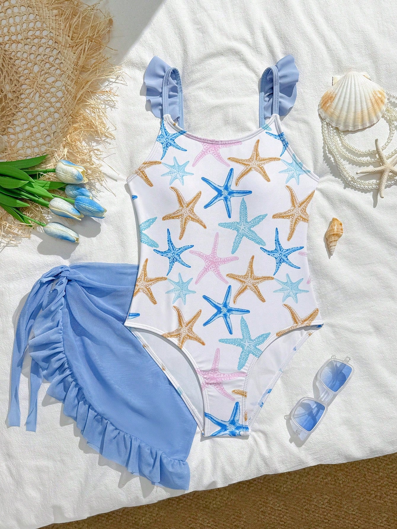 Tween girls one-piece swimsuit in leopard print with ruffle shoulder straps, scoop neckline, fitted shape, and attached ruffle hem skirt; sleeveless, mid-waist skirt bottom, and lined body for swimming, vacation, and summer beach wear.