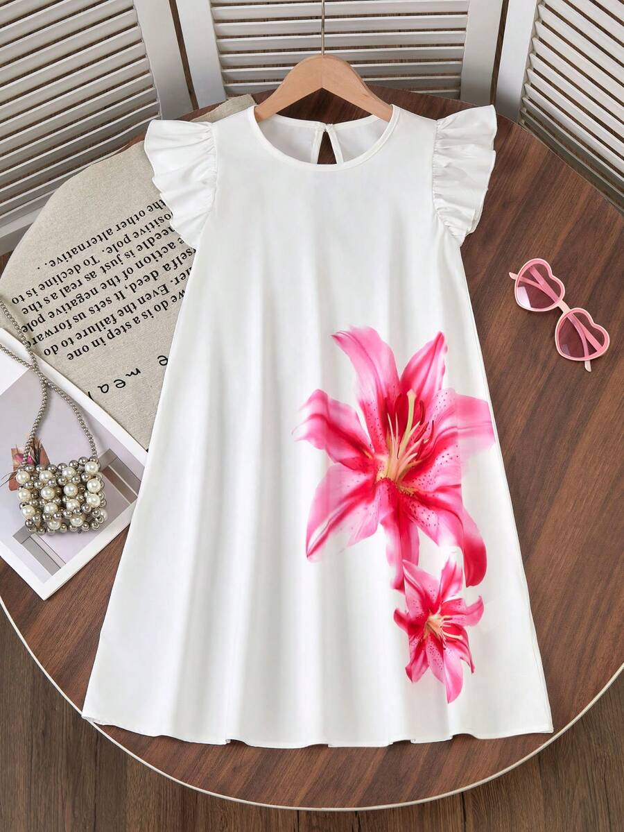 Tween girls sleeveless tropical floral mini dress in black with round neck and ruffle hem detail