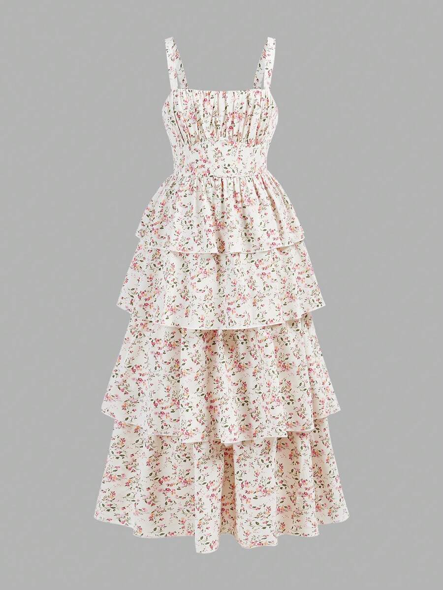 Tween girls blue ditsy floral sleeveless long dress with spaghetti straps, ruched bust, high waist, and tiered layered hem.