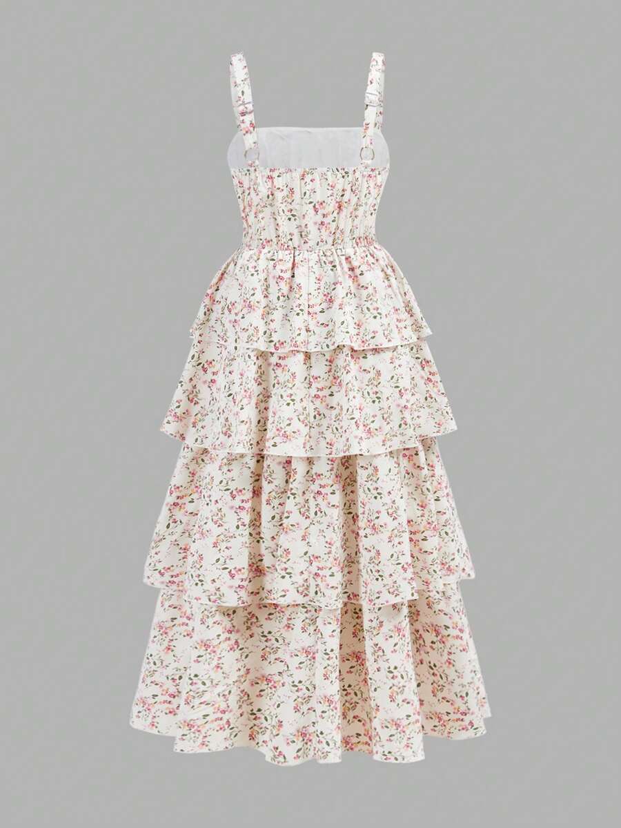 Tween girls blue ditsy floral sleeveless long dress with spaghetti straps, ruched bust, high waist, and tiered layered hem.