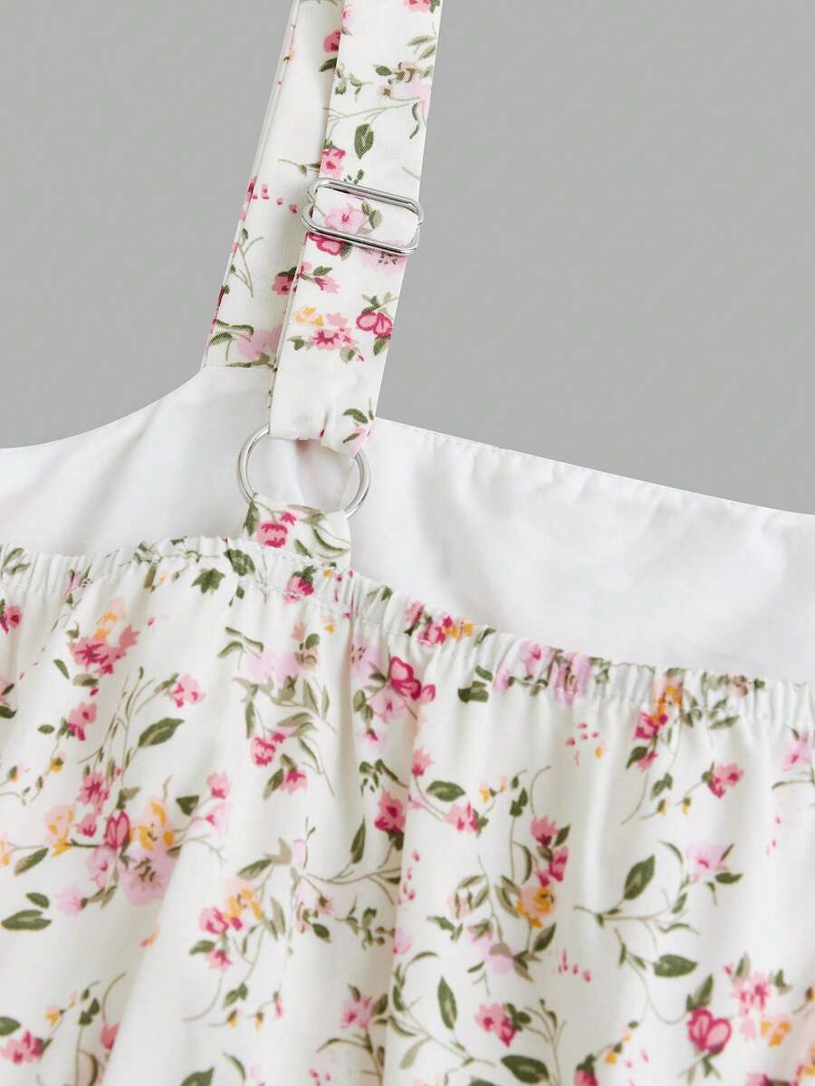 Tween girls blue ditsy floral sleeveless long dress with spaghetti straps, ruched bust, high waist, and tiered layered hem.