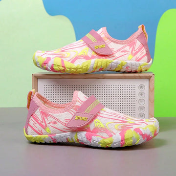 Breathable kids water shoes in white with all-over print, featuring lace-up detail and slip-on design for boys and girls.