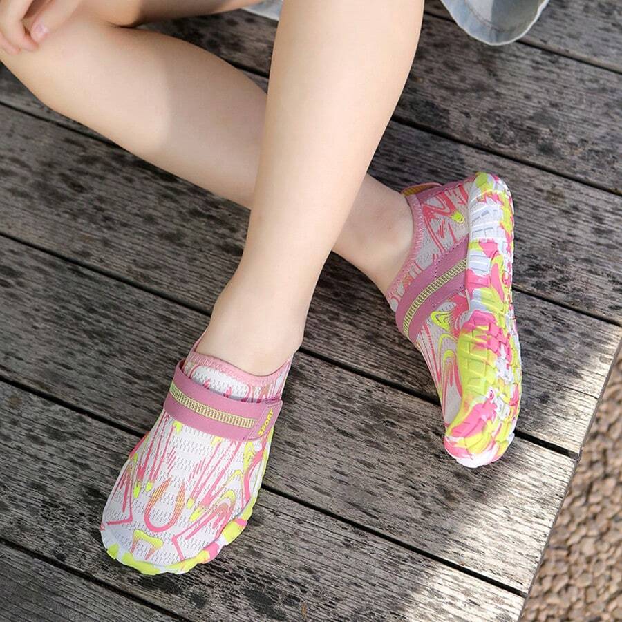 Breathable kids water shoes in white with all-over print, featuring lace-up detail and slip-on design for boys and girls.