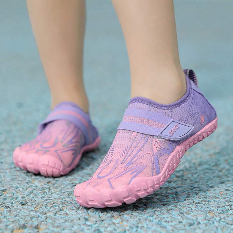 Breathable kids water shoes in white with all-over print, featuring lace-up detail and slip-on design for boys and girls.