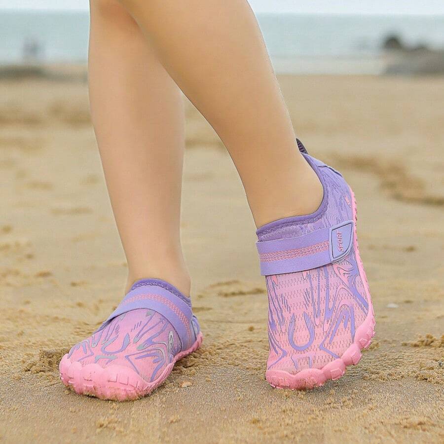 Breathable kids water shoes in white with all-over print, featuring lace-up detail and slip-on design for boys and girls.