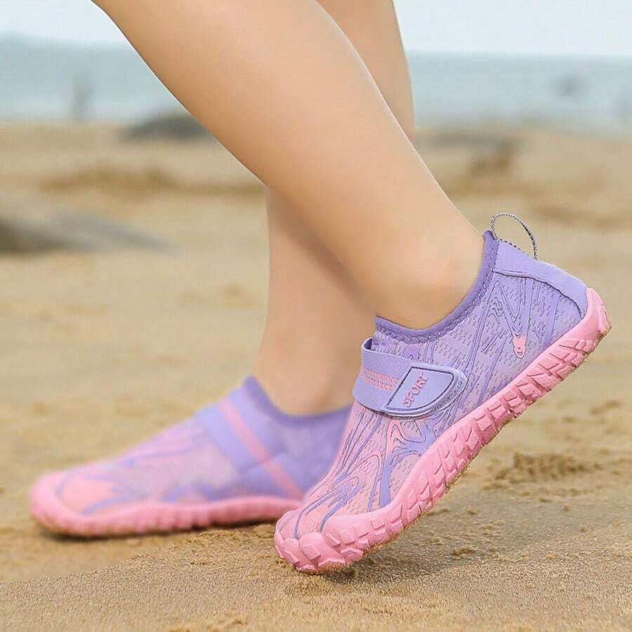 Breathable kids water shoes in white with all-over print, featuring lace-up detail and slip-on design for boys and girls.