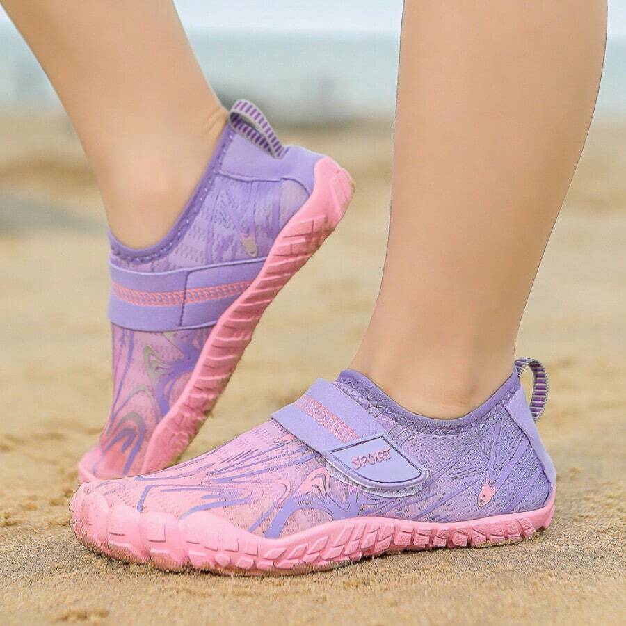 Breathable kids water shoes in white with all-over print, featuring lace-up detail and slip-on design for boys and girls.