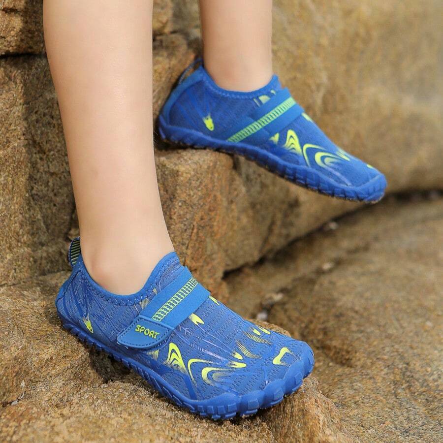 Breathable kids water shoes in white with all-over print, featuring lace-up detail and slip-on design for boys and girls.