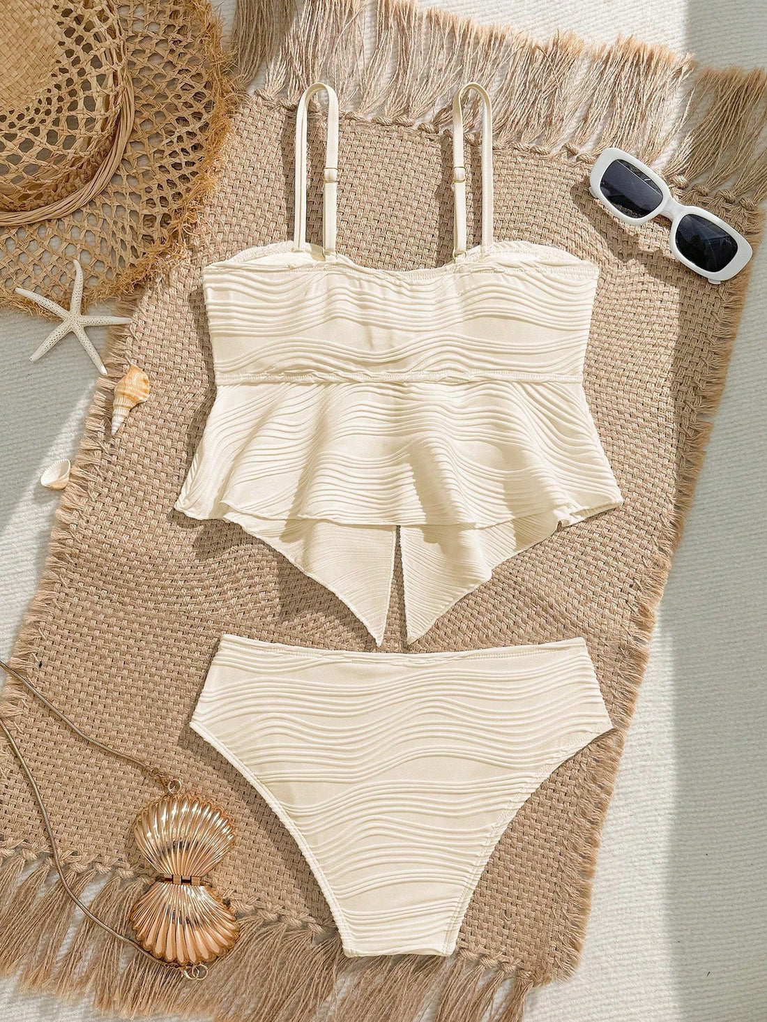 Tween girls 2-piece tankini swimwear set in apricot with a textured jacquard look, asymmetrical spaghetti-strap sleeveless top, and matching mid-waist short bikini bottoms.