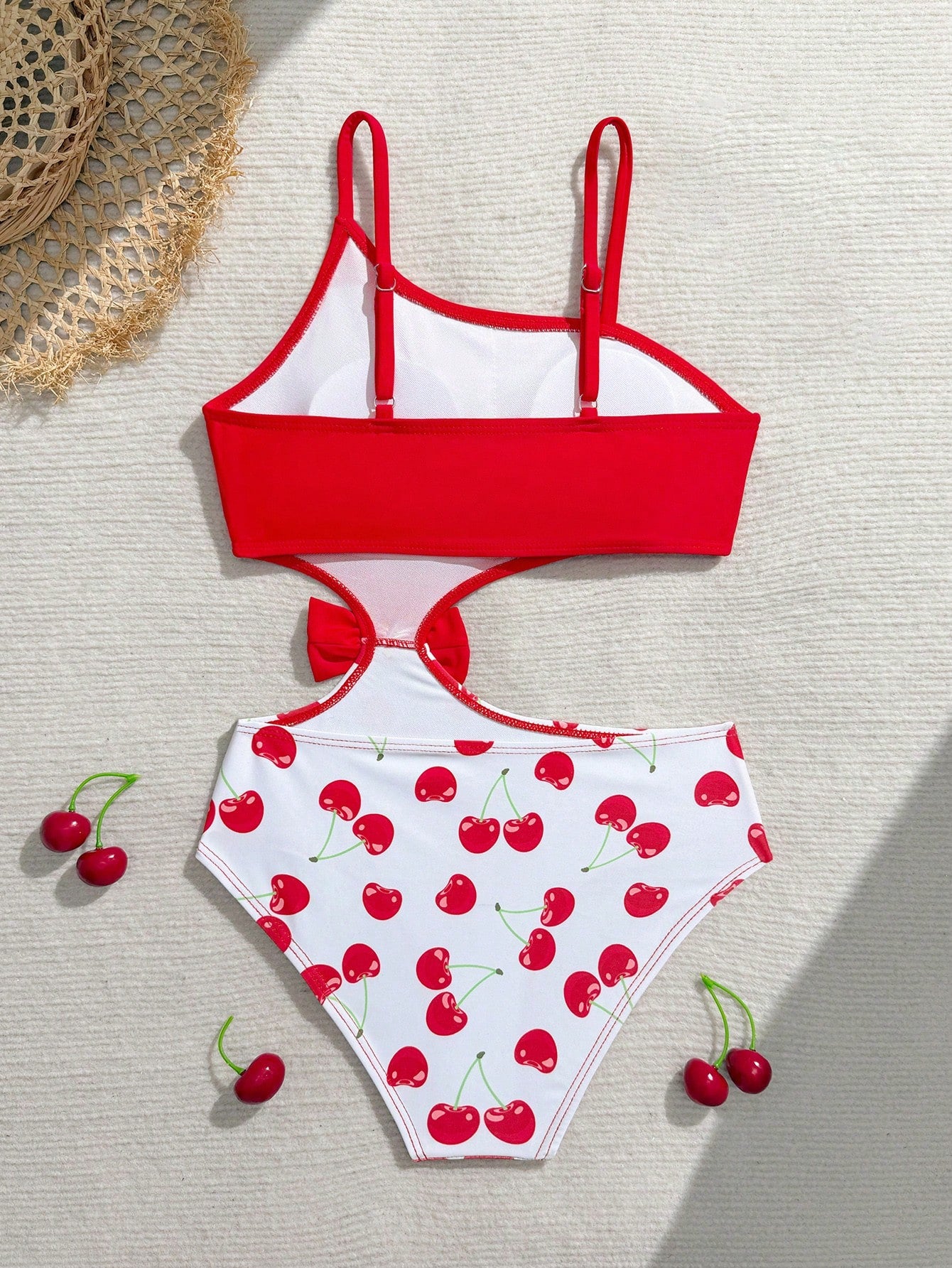 Tween girls one-piece swimsuit featuring an asymmetric neckline, pendant decor, plain design, wireless bra, high-cut bottom, and medium-stretch fabric.